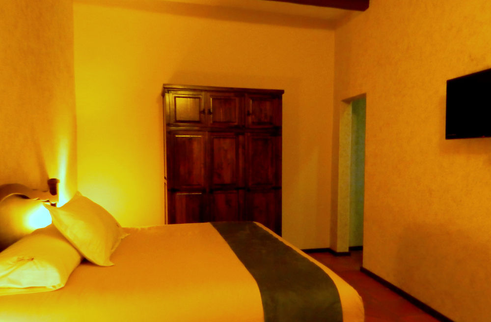 Collection O Al Otro Lado Del Rio, Puebla Otel Dış mekan fotoğraf A room at the hotel