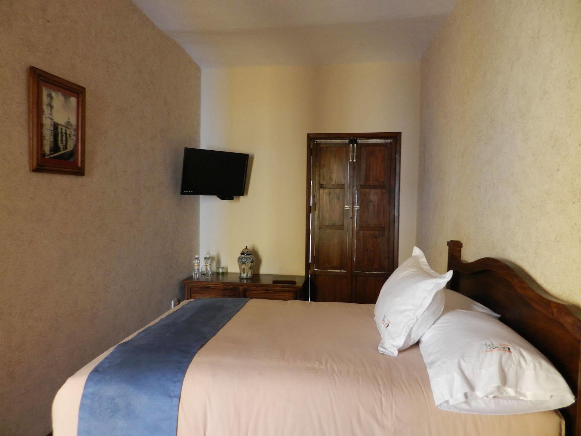 Collection O Al Otro Lado Del Rio, Puebla Otel Dış mekan fotoğraf A room at the hotel