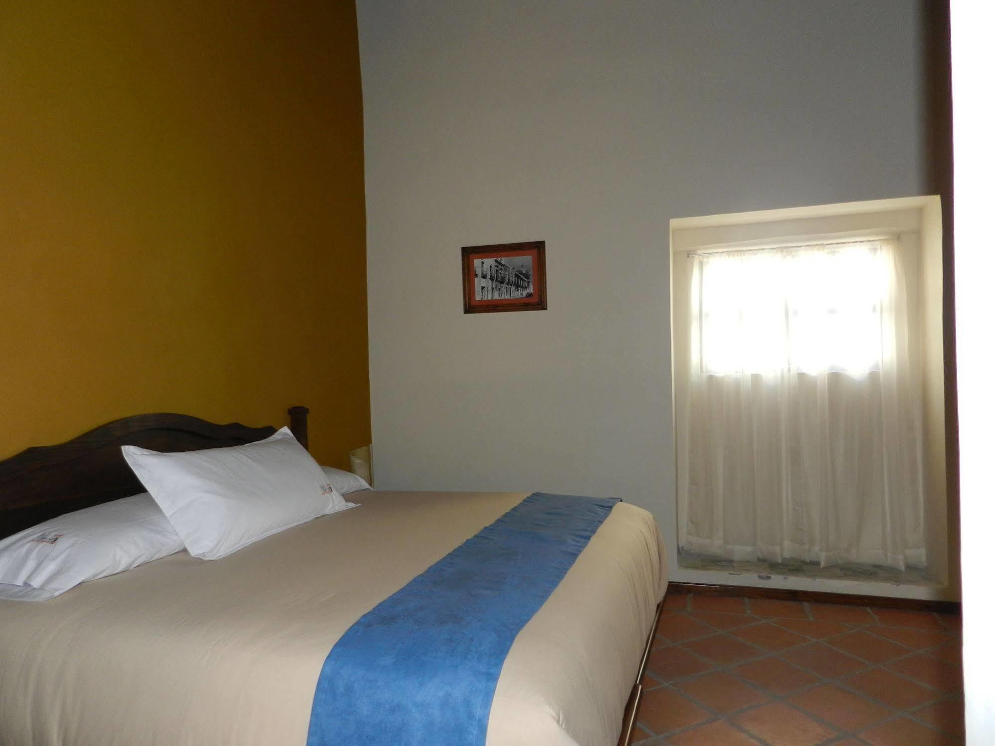 Collection O Al Otro Lado Del Rio, Puebla Otel Dış mekan fotoğraf A room at the hotel