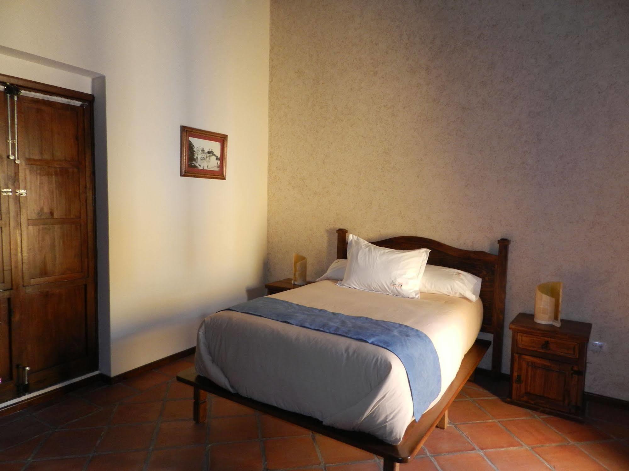 Collection O Al Otro Lado Del Rio, Puebla Otel Dış mekan fotoğraf A room at the hotel