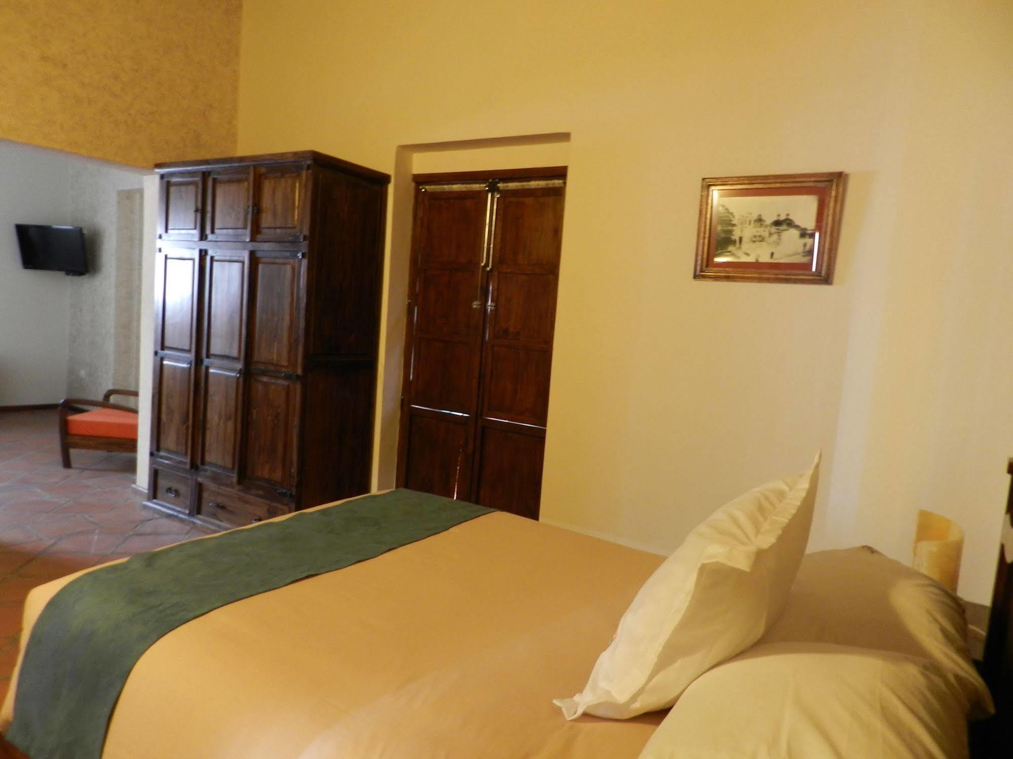 Collection O Al Otro Lado Del Rio, Puebla Otel Dış mekan fotoğraf A room at the hotel