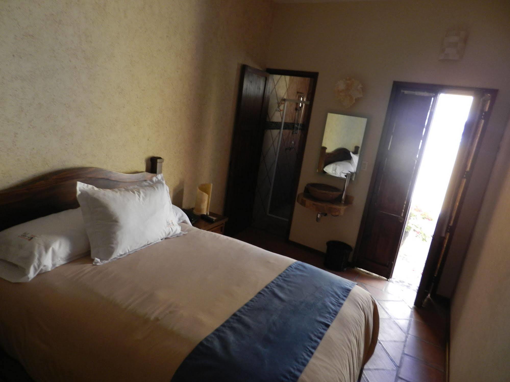 Collection O Al Otro Lado Del Rio, Puebla Otel Dış mekan fotoğraf A room at the hotel