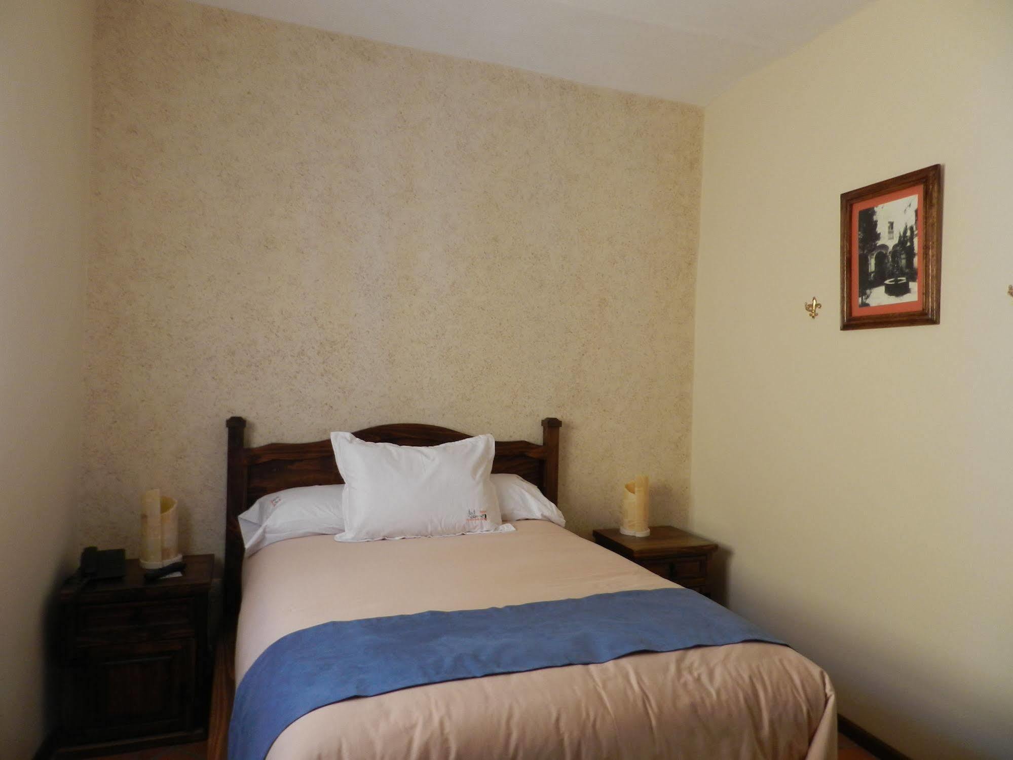 Collection O Al Otro Lado Del Rio, Puebla Otel Dış mekan fotoğraf A bedroom at the hotel