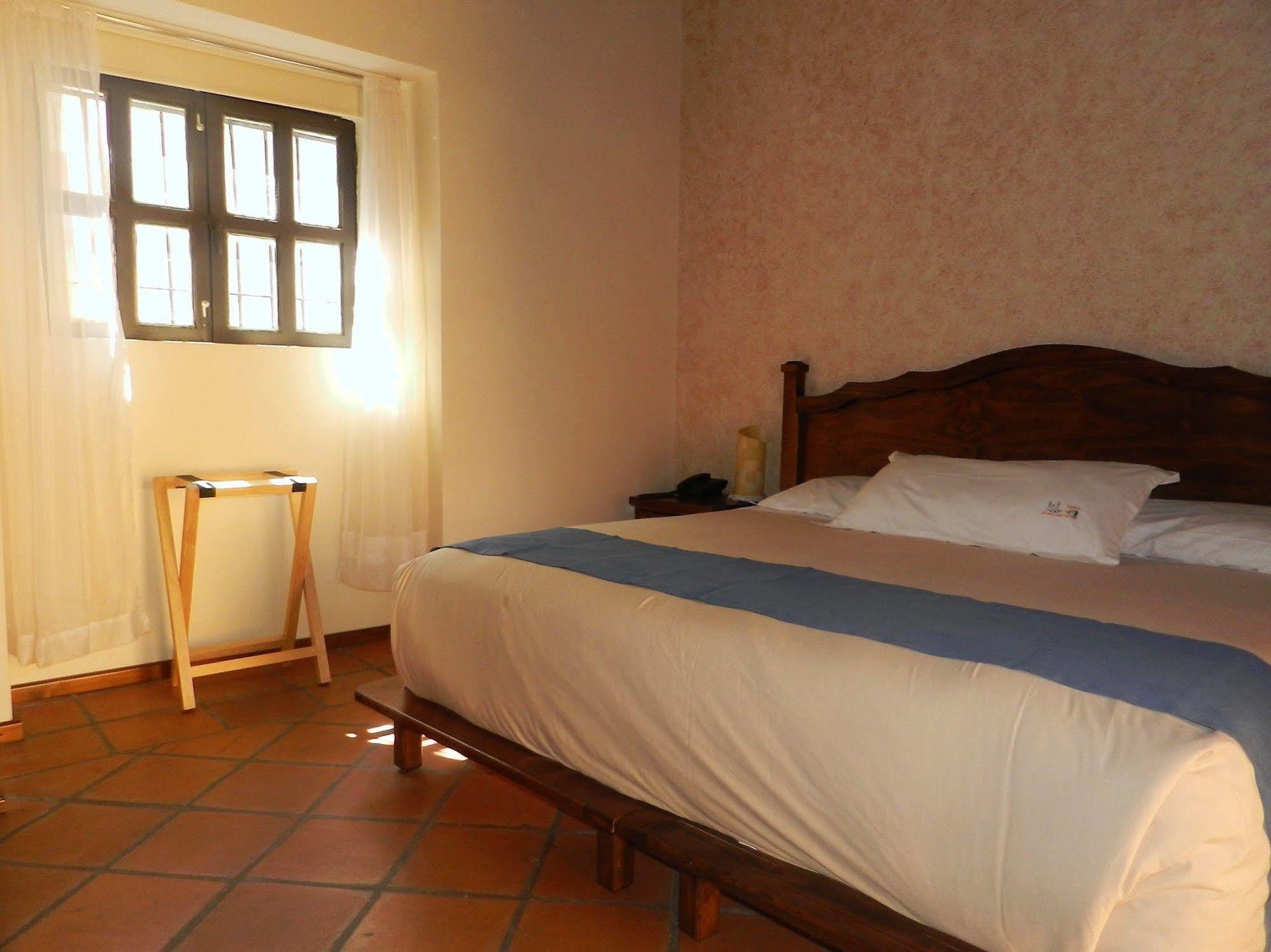 Collection O Al Otro Lado Del Rio, Puebla Otel Dış mekan fotoğraf A room at Hotel San Cristóbal